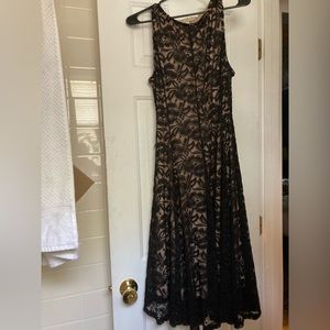 Sandiva women’s large black lace dress with nude underdress attached.